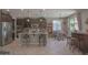 Open kitchen layout with stainless steel appliances, breakfast bar, and adjacent dining area at 16763 W Adams St, Goodyear, AZ 85338