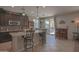 Well-equipped kitchen featuring a breakfast bar with seating and sliding glass doors to the backyard at 16763 W Adams St, Goodyear, AZ 85338