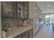 Modern kitchen featuring granite countertops, stainless steel appliances, and ample cabinet space at 16763 W Adams St, Goodyear, AZ 85338