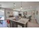 Bright and airy kitchen with an island and seamless flow into the living area at 16763 W Adams St, Goodyear, AZ 85338