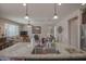 Open-concept living room with granite counters and a seamless transition into the inviting living area at 16763 W Adams St, Goodyear, AZ 85338