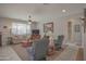 Comfortable living room with carpet flooring, neutral tones, and plenty of natural light at 16763 W Adams St, Goodyear, AZ 85338