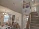 Open-concept living room with tall ceilings and staircase at 16763 W Adams St, Goodyear, AZ 85338