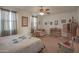 Relaxing main bedroom with soft carpet, ceiling fan, and serene ambiance for unwinding after a long day at 16763 W Adams St, Goodyear, AZ 85338