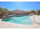 Pool includes a waterfall feature in a private backyard at 16763 W Adams St, Goodyear, AZ 85338