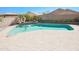 Beautiful swimming pool featuring a tiled waterfall accent at 16763 W Adams St, Goodyear, AZ 85338