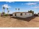 Rear exterior view of the home featuring a large backyard at 18211 N 24Th Ave, Phoenix, AZ 85023