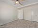Bedroom with neutral paint, gray wood-look tile floors, and ceiling fan at 18211 N 24Th Ave, Phoenix, AZ 85023