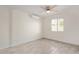 Bedroom with neutral paint, gray wood-look tile floors, and efficient mini-split unit at 18211 N 24Th Ave, Phoenix, AZ 85023