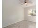 Bedroom featuring wood-look tile flooring, ceiling fan and a view to the backyard at 18211 N 24Th Ave, Phoenix, AZ 85023