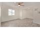 Bedroom featuring neutral paint, gray wood-look tile floors, and ceiling fan at 18211 N 24Th Ave, Phoenix, AZ 85023