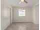 Bedroom with neutral paint, gray wood-look tile floors, window, and ceiling fan at 18211 N 24Th Ave, Phoenix, AZ 85023