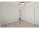 Bedroom featuring wood-look tile flooring, ceiling fan and a neutral color palette at 18211 N 24Th Ave, Phoenix, AZ 85023