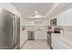 Spacious kitchen featuring modern stainless steel appliances, light cabinetry, and ample counter space at 18211 N 24Th Ave, Phoenix, AZ 85023