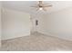 Bright living room features neutral paint, light-colored tile floors and a ceiling fan with light at 18211 N 24Th Ave, Phoenix, AZ 85023