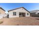 A home featuring a spacious backyard with a hot tub ready for relaxation and enjoying time outdoors at 18369 W La Senda Dr, Surprise, AZ 85387