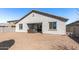 Exterior view of the back of the home showing a built-in hot tub and neutral color palette at 18369 W La Senda Dr, Surprise, AZ 85387