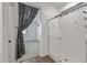 Modern bathroom featuring a glass-enclosed shower and wood-look tile floors at 18369 W La Senda Dr, Surprise, AZ 85387