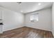 Empty bedroom showcasing the natural light and a large window at 18369 W La Senda Dr, Surprise, AZ 85387