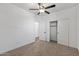 Bedroom featuring carpeted floors, ceiling fan, and closet at 18369 W La Senda Dr, Surprise, AZ 85387