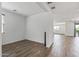 Bright, airy room with wood-look floors, white walls and lots of natural light at 18369 W La Senda Dr, Surprise, AZ 85387