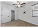 Clean bedroom, featuring carpeted floors and a sliding-door closet at 18369 W La Senda Dr, Surprise, AZ 85387
