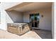 A covered backyard patio featuring a hot tub for outdoor relaxation and a sliding glass door at 18369 W La Senda Dr, Surprise, AZ 85387