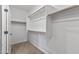 Spacious walk-in closet with ample shelving and neutral carpet at 18369 W La Senda Dr, Surprise, AZ 85387