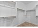 Well-organized walk-in closet with multiple shelves and rods at 18369 W La Senda Dr, Surprise, AZ 85387