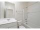 Bright bathroom featuring a single sink vanity, a toilet, and a shower-tub combination with tile surround at 19437 W Elm St, Litchfield Park, AZ 85340