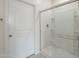 Shower featuring glass doors, modern fixtures, and a clean design at 19437 W Elm St, Litchfield Park, AZ 85340