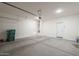 Spacious two car garage with overhead door, perfect for parking and storage at 19437 W Elm St, Litchfield Park, AZ 85340