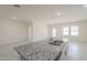 Kitchen island featuring granite countertops and a stainless steel sink, perfect for food preparation at 19437 W Elm St, Litchfield Park, AZ 85340