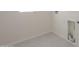 Convenient laundry room with tile floor, utility connections, and a window at 19437 W Elm St, Litchfield Park, AZ 85340