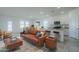Open-concept living room featuring modern decor and a neutral color palette for a bright and airy feel at 19437 W Elm St, Litchfield Park, AZ 85340