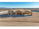 New construction features the home's framing stage, set on a large lot offering clear mountain views in the distance at 20255 W Highland Ave, Litchfield Park, AZ 85340