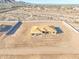Aerial view showcasing a new home in the framing stage within a new community at 20256 W Highland Ave, Litchfield Park, AZ 85340