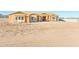 Exterior view of a framed house under construction on a desert homesite awaiting personalization and landscaping at 20274 W Highland Ave, Litchfield Park, AZ 85340