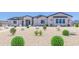 Beautiful single-story home with desert landscaping and modern architectural details at 20277 W Highland Ave, Litchfield Park, AZ 85340