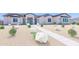 Charming single-story home featuring desert landscaping and a well-defined walkway at 20277 W Highland Ave, Litchfield Park, AZ 85340