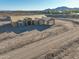 Aerial view of new home construction, framing stage, showing layout with mountain backdrop at 20277 W Highland Ave, Litchfield Park, AZ 85340