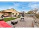 Backyard featuring patio, synthetic grass and BBQ at 2110 S 102Nd Ln, Tolleson, AZ 85353
