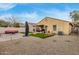Backyard features covered patio, synthetic grass, and brick pavers at 2110 S 102Nd Ln, Tolleson, AZ 85353