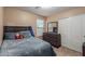 Comfortable bedroom with carpet, dresser, mirror, and large closet at 2110 S 102Nd Ln, Tolleson, AZ 85353