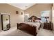 A primary bedroom showcases a king-size bed and neutral decor at 2110 S 102Nd Ln, Tolleson, AZ 85353