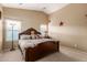 Bedroom featuring vaulted ceiling, neutral walls and cozy decor at 2110 S 102Nd Ln, Tolleson, AZ 85353