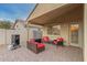 Covered patio featuring brick pavers and an outdoor seating area at 2110 S 102Nd Ln, Tolleson, AZ 85353