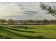 Outdoor community basketball court with shaded seating and lush green space at 2232 W Chisum Trl, Phoenix, AZ 85085