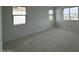 Bright and spacious bedroom featuring multiple windows for ample natural light and unfinished floors at 2232 W Chisum Trl, Phoenix, AZ 85085