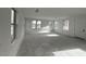 Bright and spacious living area featuring multiple windows for ample natural light and a door at 2232 W Chisum Trl, Phoenix, AZ 85085